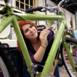 Students painting and decorating bikes in the sculpture studio, Wednesday Dec. 2, 2015. (Photo by Norm Shafer).