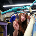 Students painting and decorating bikes in the sculpture studio, Wednesday Dec. 2, 2015. (Photo by Norm Shafer).