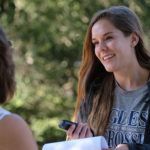 Maiah Bartlett interivews a visitor to Meadow Farm in Henrico County.