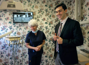 UMW senior Jake Kalkstein, who's been admitted to Howard University's dental program, spends time in the office of local dentist Dr. Theresa Young Crawley '77. Photo by Norm Shafer.
