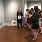 Students in the Laboratory in Museum Studies course discuss the layout and design of the exhibit.