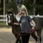 UMW students participate in the therapeutic horseback riding program at Hazelwild Farm. Photo by Reza A. Marvashti.