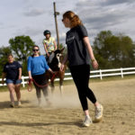 UMW students participate in the therapeutic horseback riding program at Hazelwild Farm. Photo by Reza A. Marvashti.