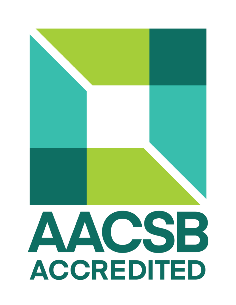 The AACSB logo features a stylized square shield shape with a aqua blue and light green color scheme. The letters "AACSB" are prominently displayed in dark green underneath the shield, with the word "Accredited" written in smaller font below the shield. AACSB stands for the Association to Advance Collegiate Schools of Business.