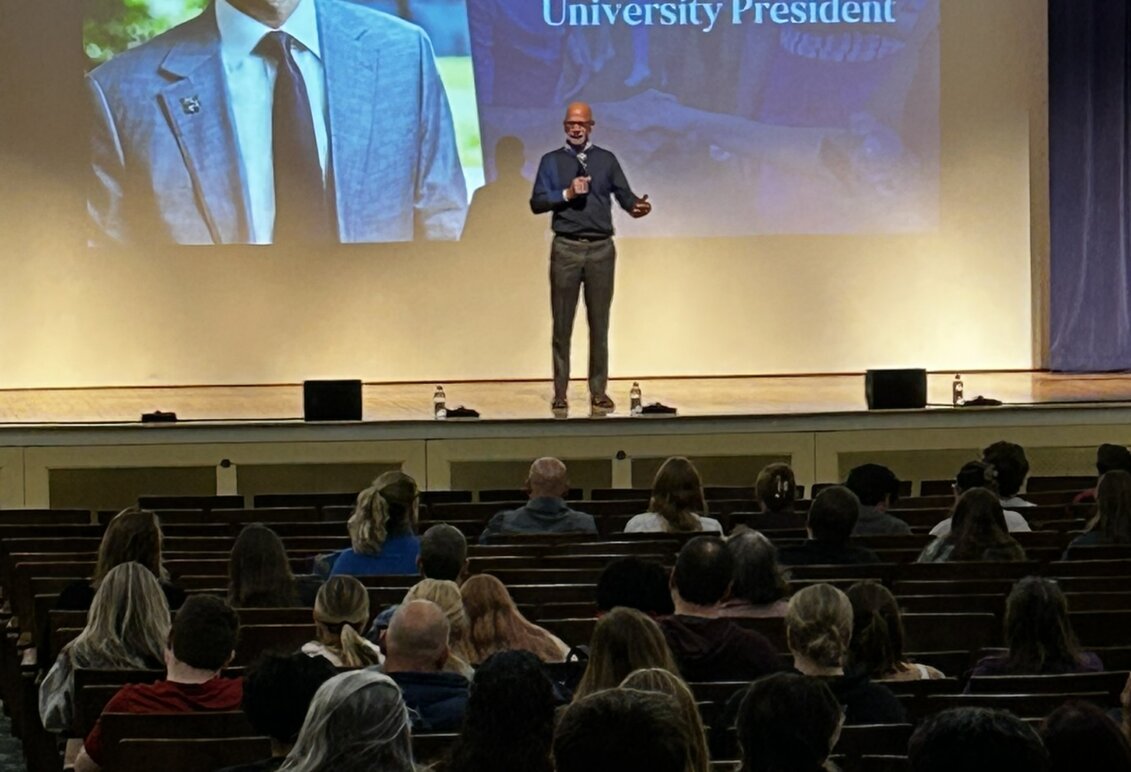 Dr. Paino speaks from the stage at Open House