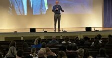 Dr. Paino speaks from the stage at Open House