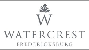 Watercrest Fredericksburg with a fleur de lis type of graphic above the letter W