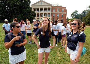 Orientation leaders, and best friends, Sam Kasner,, center and Samantha Amos, right, Sunday August 23, 1015. (Photo by Norm Shafer).