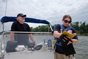 Neil Tibert navigates the Westmoreland County waters, while Megan Clevenger records field notes.