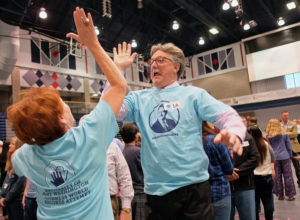 Simultaneous jumping high five, Guinness World Record attempt, at UMW Wednesday April 13, 2016. (Photo by Norm Shafer).