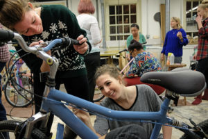 Students painting and decorating bikes in the sculpture studio, Wednesday Dec. 2, 2015. (Photo by Norm Shafer).