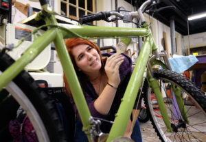 Students painting and decorating bikes in the sculpture studio, Wednesday Dec. 2, 2015. (Photo by Norm Shafer).