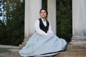Laura posing in period costume.