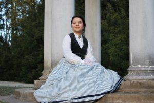 Laura posing in period costume.