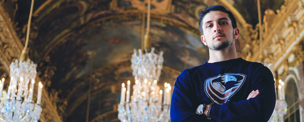 Alex Clegg stands inside the Palace of Versailles. Photo Credit: Maggie Gialamas