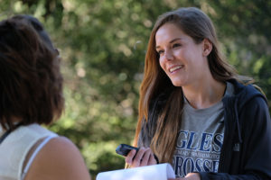 Maiah Bartlett interivews a visitor to Meadow Farm in Henrico County.