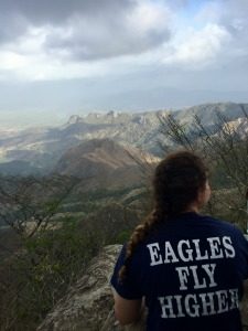 Ann Izzard enjoys the summit of a cloud-mountain peak in Panama.