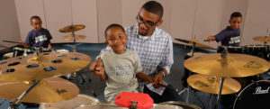 UMW junior Ben Henderson works with young children at the Family Life Center in Fredericksburg. Henderson, who is double majoring in religion and sociology, is set on going to seminary school and focused on building better communities. Photo by Norm Shafer.