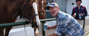 UMW President Troy D. Paino shares ice cream from Carl's with a four-legged friend. Photo by Norm Shafer.