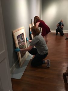 Students in the Laboratory in Museum Studies course discuss the layout and design of the exhibit.