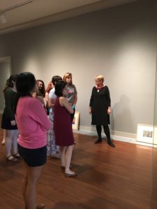 Students in the Laboratory in Museum Studies course discuss the layout and design of the exhibit.