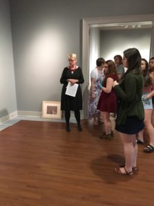 Students in the Laboratory in Museum Studies course discuss the layout and design of the exhibit.