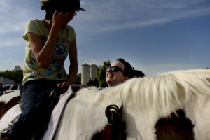 UMW students participate in the therapeutic horseback riding program at Hazelwild Farm. Photo by Reza A. Marvashti.