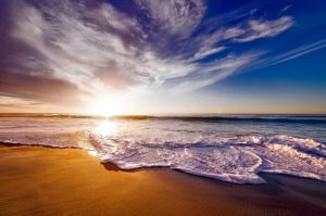 a beach overlooking a sunrise