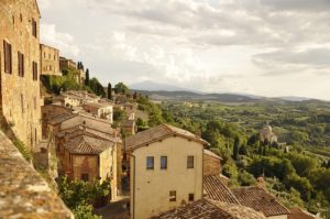 italian countryside with homes and rolling hills