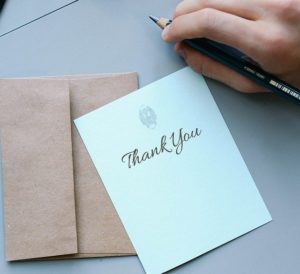 a note card that reads 'thank you'