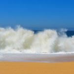 waves crashing against shoreline