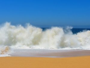 waves crashing against shoreline