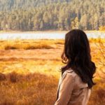 woman with back to camera looking at nature