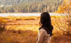 woman with back to camera looking at nature