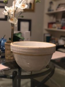 a large, beige ceramic bowl