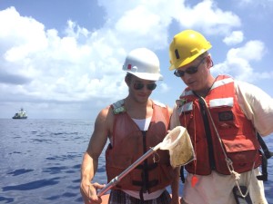 Matthew Walters '16 and Charlie Sharpless inspecting an oil sampling net in the Gulf of Mexico.