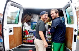 UMW Athletics helps load a van with food.