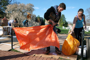 UMW students set up their shelter for the week long two dollar a day challenge, Monday, April 6, 2015. (Photo by Norm Shafer).