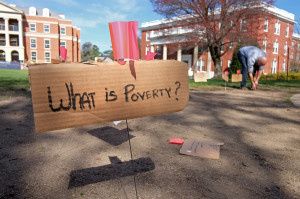 UMW students set up their shelter for the week long two dollar a day challenge, Monday, April 6, 2015. (Photo by Norm Shafer).