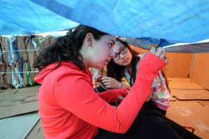 UMW students set up their shelter for the week long two dollar a day challenge, Monday, April 6, 2015. (Photo by Norm Shafer).