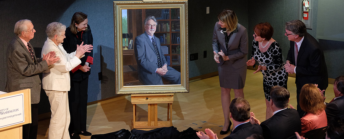 Applause erupts as President Hurley's portrait is unveiled.
