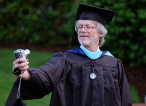 Les Brown takes his own picture before the UMW graduate school graduation, May 6, 2015. (Photo by Norm Shafer).