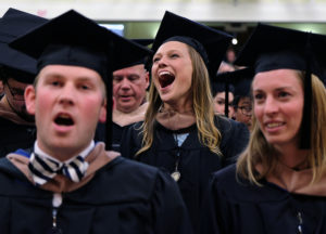 Brie Matthes belts out the alma mater at the conclusion of the UMW graduate school graduation, May 6, 2015. (Photo by Norm Shafer).