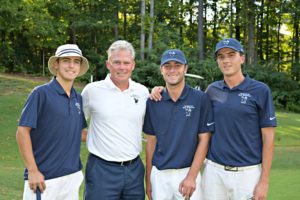 Coach Wood with members of the men's golf team.