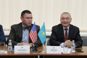 Consulate General of the United States in Almaty Mark Moody (left) and al-Farabi Kazakh National University First Vice Rector Mukhambetkali Burkitbayev have expressed gratitude to faculty members from UMW's Department of Political Science and International Affairs for contributing to a book drive headed by Professor Steve Farnsworth. The books were given to al-Farabi University in Kazakhstan.