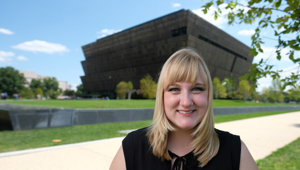 UMW senior Lindsey Crawford stands in front of the Smithsonian's wildly popular National Museum of African American History and Culture, where she completed a prestigious summer internship. Photo by Norm Shafer.