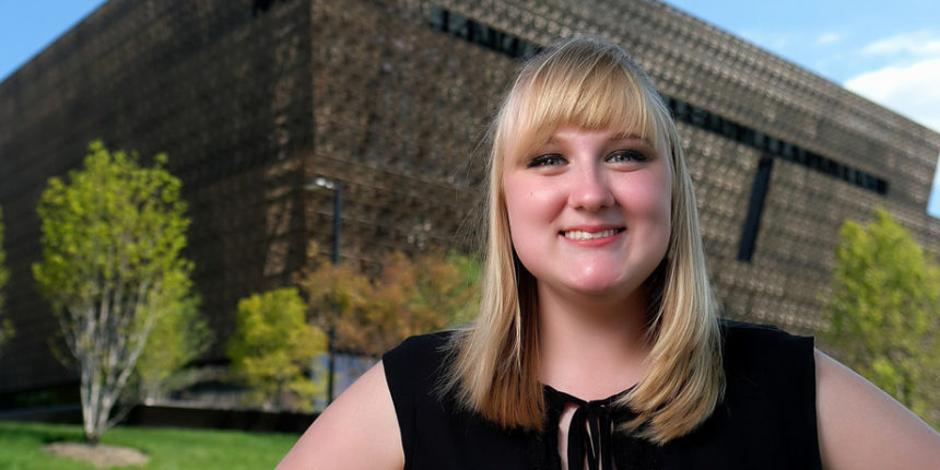 UMW senior Lindsey Crawford stands in front of the Smithsonian's wildly popular National Museum of African American History and Culture, where she completed a prestigious summer internship. Photo by Norm Shafer.