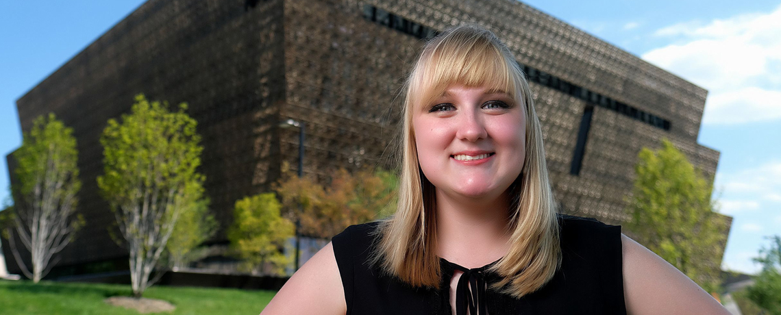 UMW senior Lindsey Crawford stands in front of the Smithsonian's wildly popular National Museum of African American History and Culture, where she completed a prestigious summer internship. Photo by Norm Shafer.