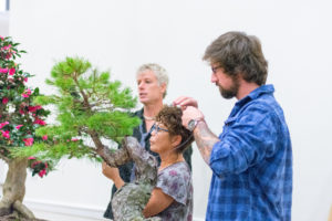 Todd Stewart (far left), co-owner of Gardens Unlimited, brought his bonsai expertise to Mary Washington. He and business partner Bob Chilton designed UMW's new Zen garden, set to open by spring. Photo by Jarred Cannon.