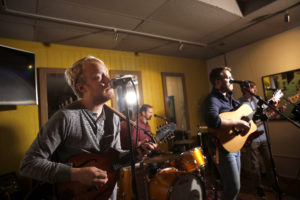 UMW alumni Jackson Wright (foreground, on bass) and Will McCarry (on guitar) are members of the band Wylder.
